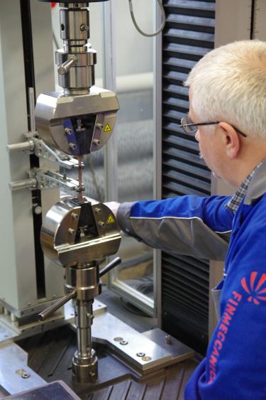 Working on the MTS machine during strength tests in the Laboratory